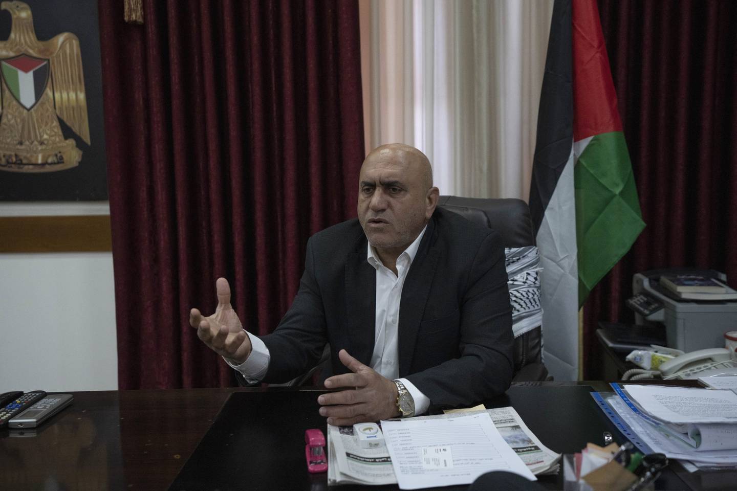 Jenin's governor, Akram Rajoub, talks to reporters at his office in the West Bank. AP Photo