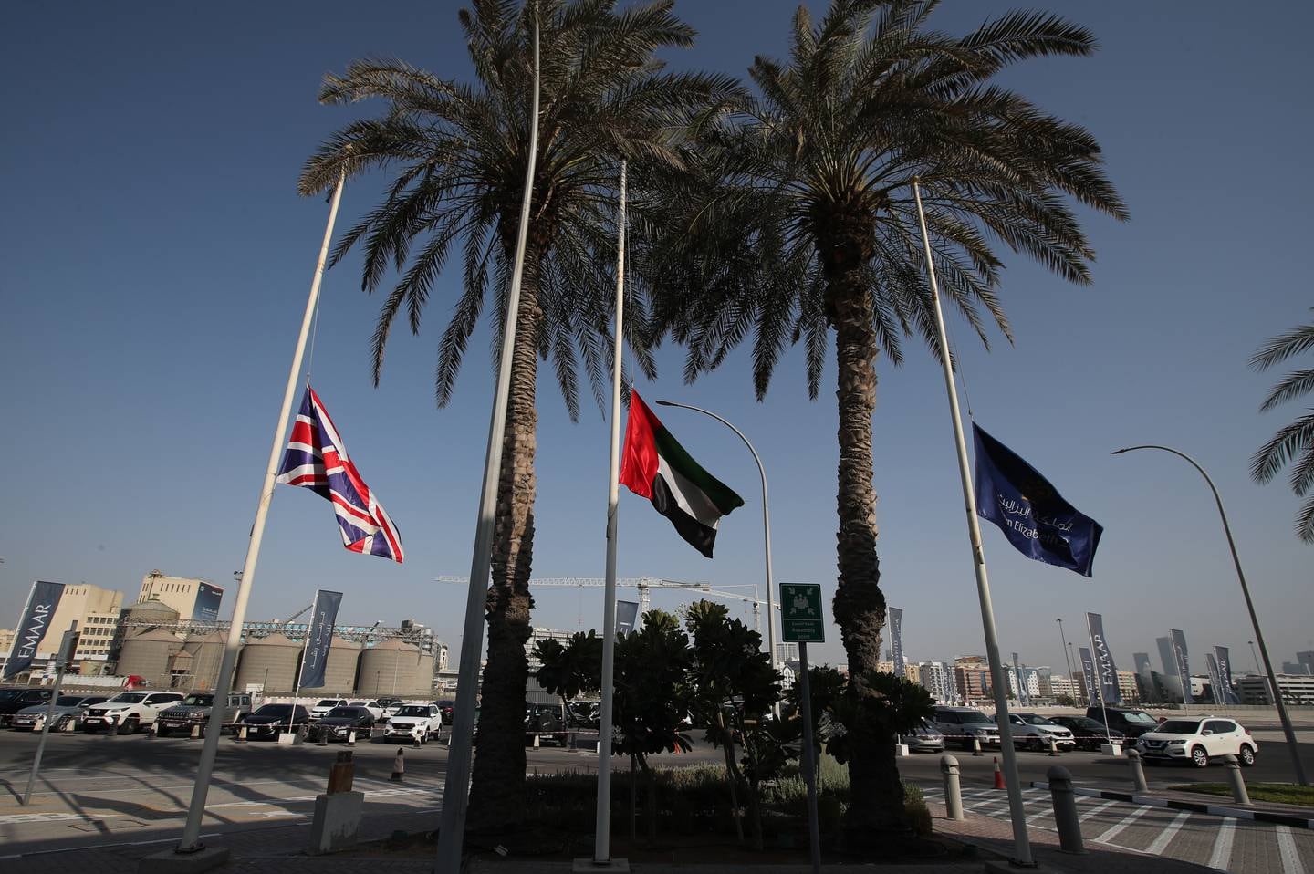 British and UAE national flags fly at half mast in Dubai. EPA
