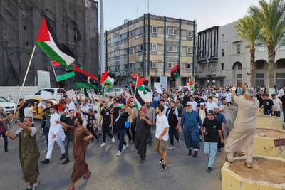Libyans carrying Palestinian and Libyan flags march in solidarity with the people of Palestine in Martyr's Square in the capital Tripoli. AFP