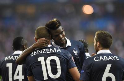 France's Paul Pogba celebrates with Karim Benzema after scoring a goal in their team's 2-1 win over Portugal in Paris on Saturday night. Franck Fife / AFP / October 11, 2014 