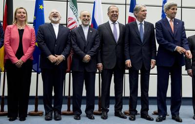 Members of the negotiating team celebrate after reaching an agreement on Iran's nuclear programme. Joe Klamar / AP
