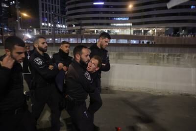 Police arrest a protester in Tel Aviv. EPA