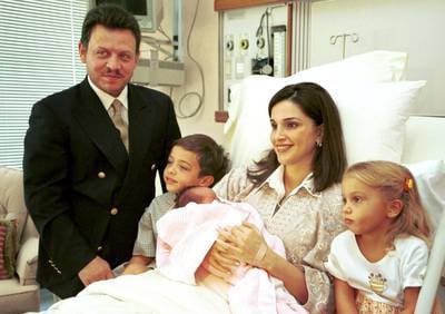 Prince Hussein, second from left, with his father King Abdullah and mother Queen Rania, as she holds newborn Princess Salma on September 26, 2000, with Princess Iman, right. Photo: Royal Hashemite Court