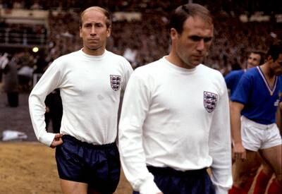 England's Ray Wilson, right, and Bobby Charlton walk out before the 1966 World Cup final. PA