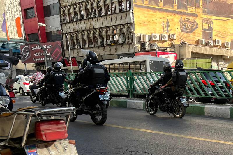 Iranian police patrol the streets.