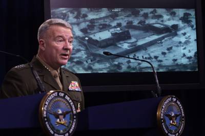 US Marine Corps Gen. Kenneth McKenzie, commander of US Central Command, speaks as a picture of the operation targeting Abu Bakr al-Baghdadi is seen during a press briefing at the Pentagon in Arlington, Virginia. AFP