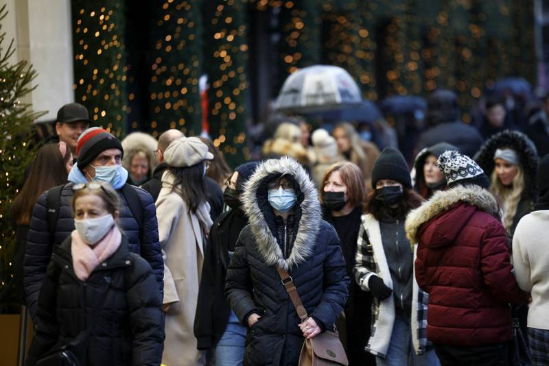 London's Oxford Street. An epidemiologist in the UK says anyone who feels unwell should stay away from the office or Christmas parties. Reuters