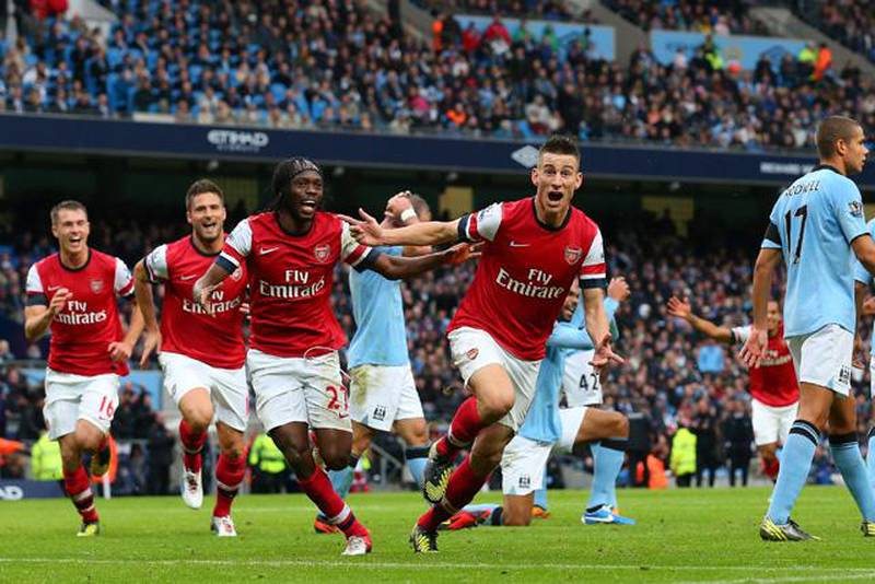 MANCHESTER, ENGLAND - SEPTEMBER 23:  Laurent Koscielny of Arsenal celebrates after scoring their first goal during the Barclays Premier League match between Manchester City and Arsenal at Etihad Stadium on September 23, 2012 in Manchester, England.   (Photo by Alex Livesey/Getty Images)