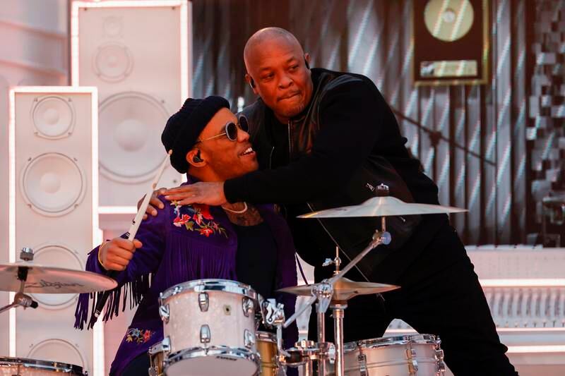 Dr Dre hugs rapper Anderson .Paak who played the drums. EPA