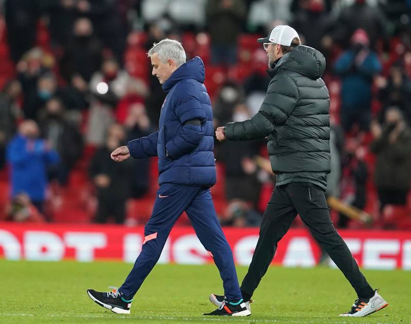 Tottenham's Jose Mourinho and Liverpool's manager Jurgen Klopp walk on to the pitch at the end of the game. AP