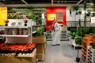 A customer wears a protective face mask while shopping in the plant department at an Ikea AB store in Riyadh, Saudi Arabia. Bloomberg