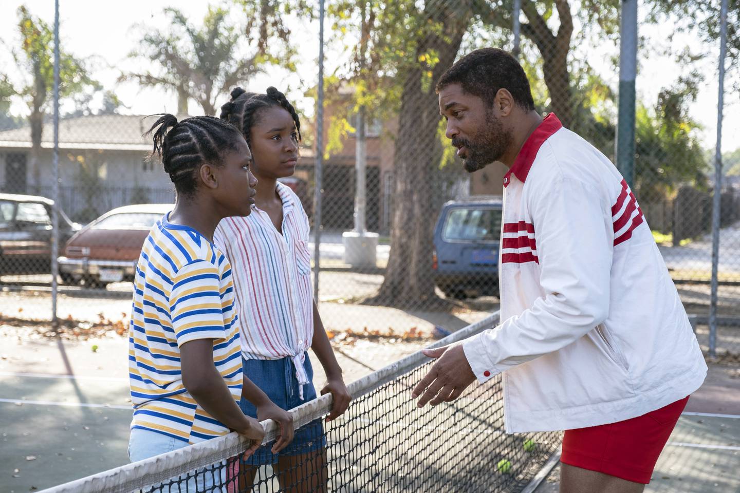 Will Smith with Demi Singleton, left, and Saniyya Sidney in a scene from 'King Richard.' Photo: Warner Bros