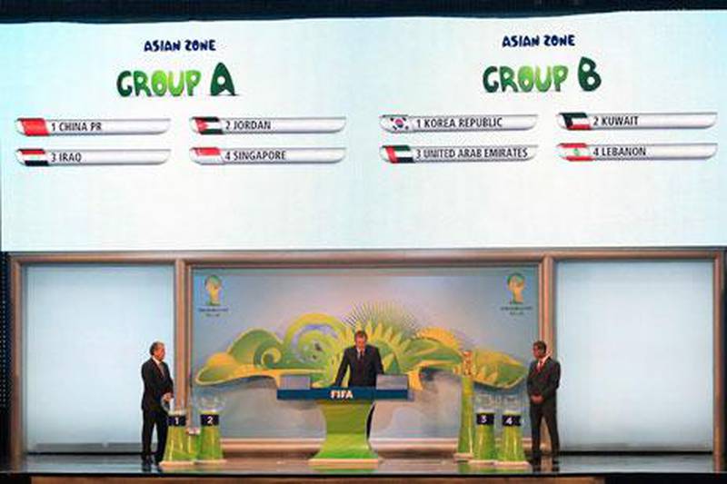 Jerome Valcke, centre, Fifa's general secretary, presides as Brazil's Lucas, left, and Zico draw the names of Asian countries during the qualifying draw for the 2014 World Cup.