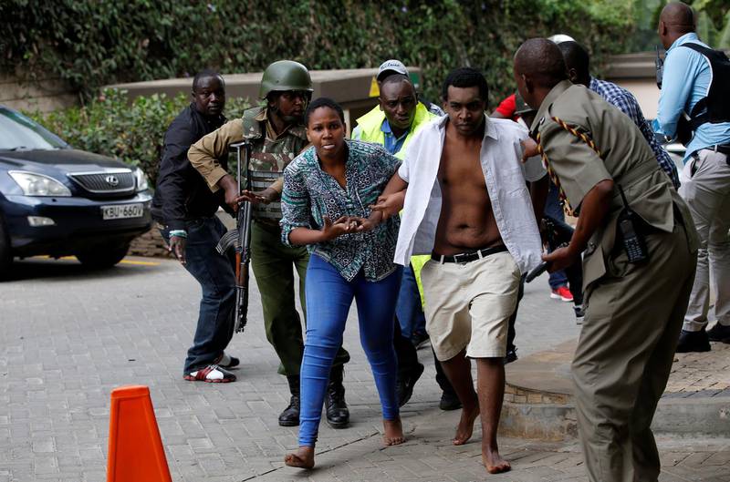 People are evacuated at the scene where explosions and gunshots were heard at the Dusit hotel compound, in Nairobi, Kenya. Thomas Mukoya / Reuters