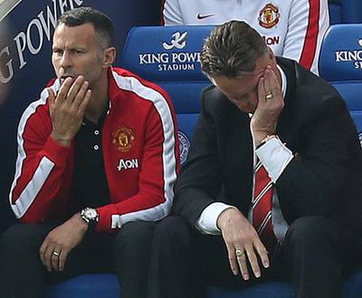 Manchester United manager Louis van Gaal, right, reacts during his side's Premier League loss to Leicester City on Sunday, as assistant Ryan Giggs, left, looks on. Kieran Galvin / EPA / September 21, 2014 DataCo_Terms_and_Conditions.pdf
