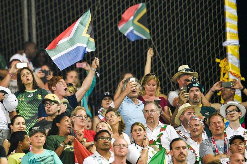 South Africa fans cheer during the Dubai Rugby Sevens. Stringer / AFP