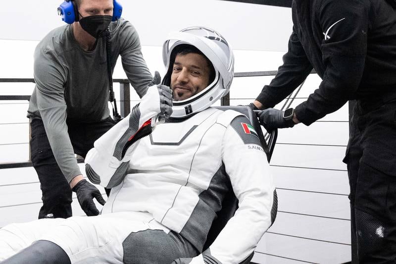 Sultan Al Neyadi gives the thumbs up as he is helped from the SpaceX Dragon capsule. Photo: Nasa