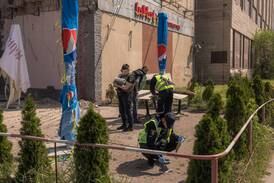 Police at the site of a building damaged during a Russian drone attack on Sunday. Getty Images