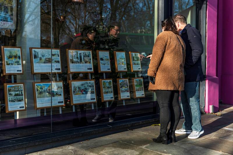 People look at properties on display in the window of Winkworth estate agents in Islington, London. Owners in the capital secured the biggest profits from their home sales last year. Reuters