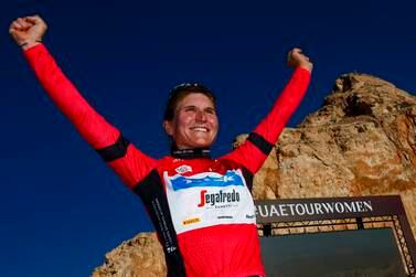 Elisa Longo Borghini celebrates in the leader's red jersey after winning stage 3 of the UAE Tour Women at Jebel Hafeet on February 11, 2023. – Abu Dhabi Sports Council