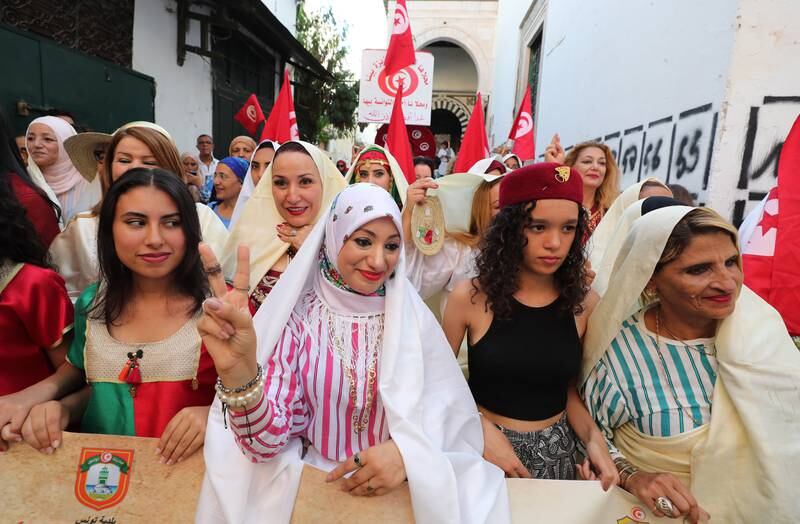 Tunisian women during a celebration of National Women's Day in Tunis, Tunisia, 13 August 2022.  Tunisia is celebrating on 13 August the National Women's Day which coincides with the 63rd anniversary of the Promulgation of the Personal Status Code which marks the break with archaic practices devaluing Tunisian women.  Tunisian women celebrate Women's Day twice a year, 08 March, International Women's Rights Day, and 13 August, anniversary of the Personal Status Code.   EPA / MOHAMED MESSARA