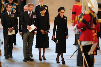 Prince Harry, Meghan and Kate, Princess of Wales, attend a service for the reception of Queen Elizabeth's coffin at Westminster Hall. AFP