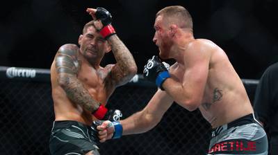 Justin Gaethje, right, throws a punch against Dustin Poirier during their lightweight fight at UFC 291 at the Delta Center July 29, 2023 at Salt Lake City, Utah. AFP