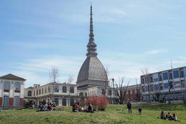People visit the Royal Gardens in Turin, taking advantage of the last weekend before the strengthening of coronavirus measures in Italy. EPA