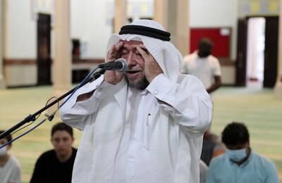 Imam Abdul Muhsin Abdul Rahman intones evening prayers at Jumeirah Mosque in Dubai as the UAE reflected on the death of President Sheikh Khalifa. Pawan Singh / The National 