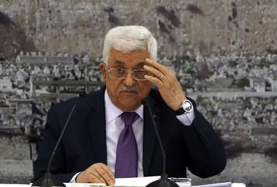 Palestinian president Mahmoud Abbas at a meeting with Palestinian leaders on December 18, 2014, in the West Bank city of Ramallah. The Palestinians have presented a draft UN resolution laying out terms for a final peace deal with Israel. Abbas Momani / AFP Photo