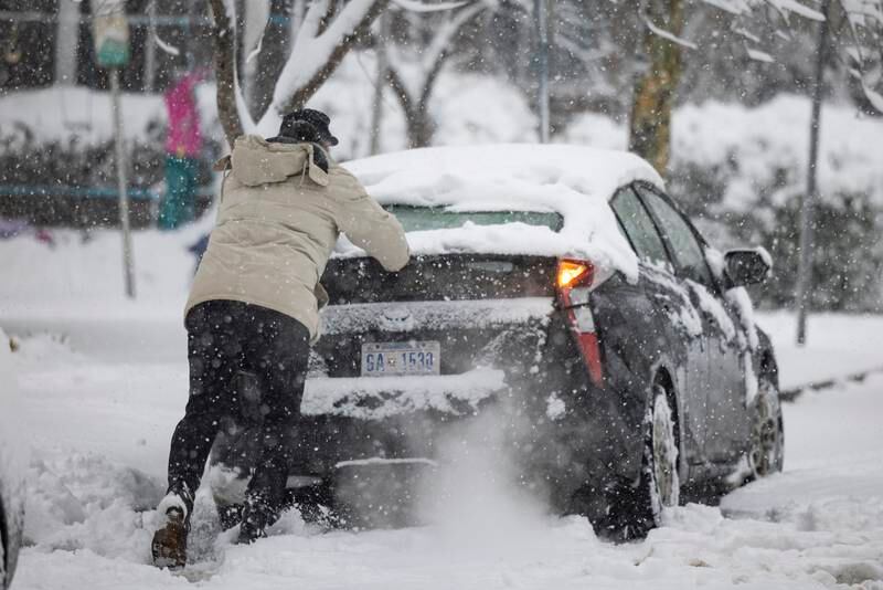 Numerous cars became stuck during the snowstorm in Washington. EPA