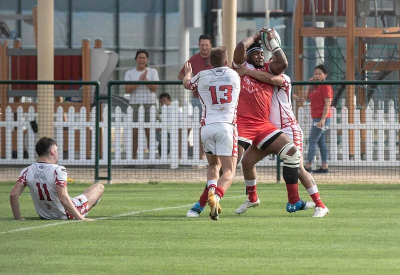 Action from the UAE Premiership game between Abu Dhabi Harlequins (in white) and Dubai Tigers. Antonie Robertson / The National
