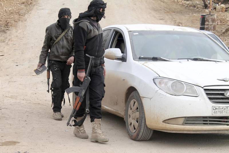 Members of Islamist Syrian rebel group Jabhat Al Nusra man a checkpoint on the southern border crossing between Syria and Jordan. Ammar Khassawneh / Reuters