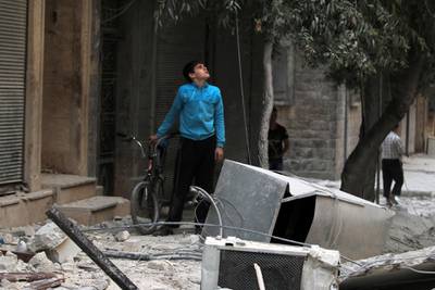 A youth inspects a damaged site after an airstrike in the besieged rebel-held al-Qaterji neighbourhood of Aleppo, Syria October 14, 2016. REUTERS/Abdalrhman Ismail