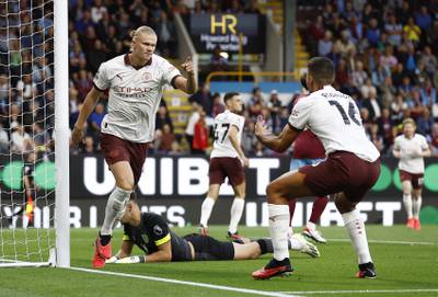Soccer Football - Premier League - Burnley v Manchester City - Turf Moor, Burnley, Britain - August 11, 2023 Manchester City's Erling Braut Haaland celebrates scoring their first goal with teammate Rodri Action Images via Reuters/Jason Cairnduff EDITORIAL USE ONLY.  No use with unauthorized audio, video, data, fixture lists, club/league logos or 'live' services.  Online in-match use limited to 75 images, no video emulation.  No use in betting, games or single club /league/player publications.   Please contact your account representative for further details. 