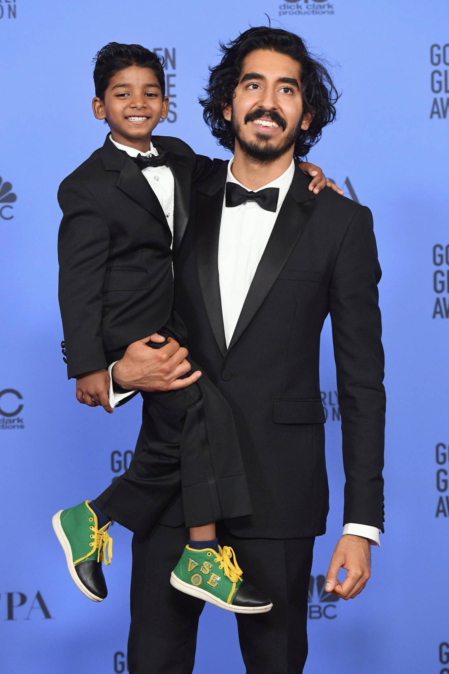 BEVERLY HILLS, CA - JANUARY 08: Actors Sunny Pawar (L) and Dev Patel pose in the press room during the 74th Annual Golden Globe Awards at The Beverly Hilton Hotel on January 8, 2017 in Beverly Hills, California.   Kevin Winter/Getty Images/AFP