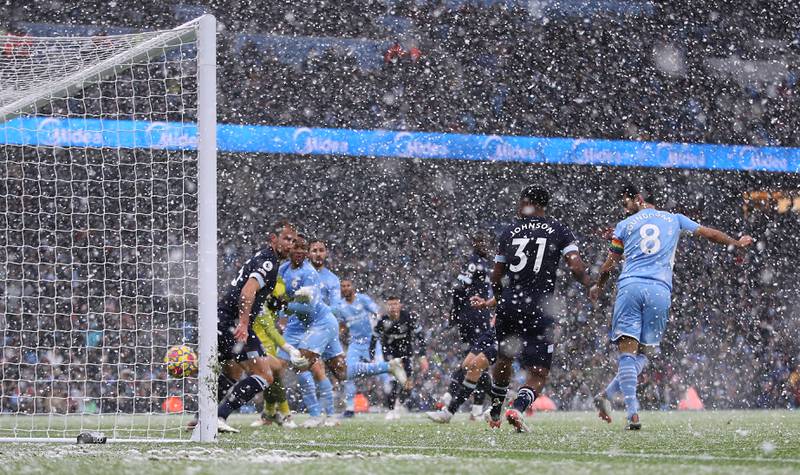 Ilkay Gundogan scores for Manchester City against West Ham. AP