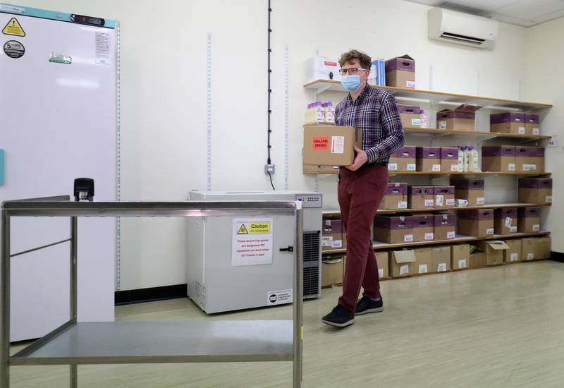 Assistant Technical Officer Lukasz Najdrowski handles doses of the Oxford University/AstraZeneca vaccine as they arrive at the Princess Royal Hospital in Haywards Heath. Reuters