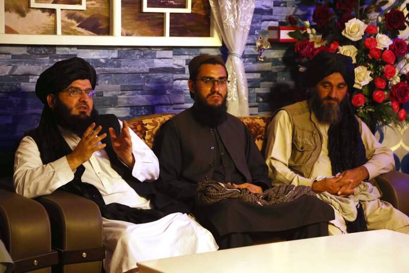 Qari Muhammad Hanif, centre, director of the Taliban's cultural and Information department, talks to journalists in Jalalabad, Afghanistan.