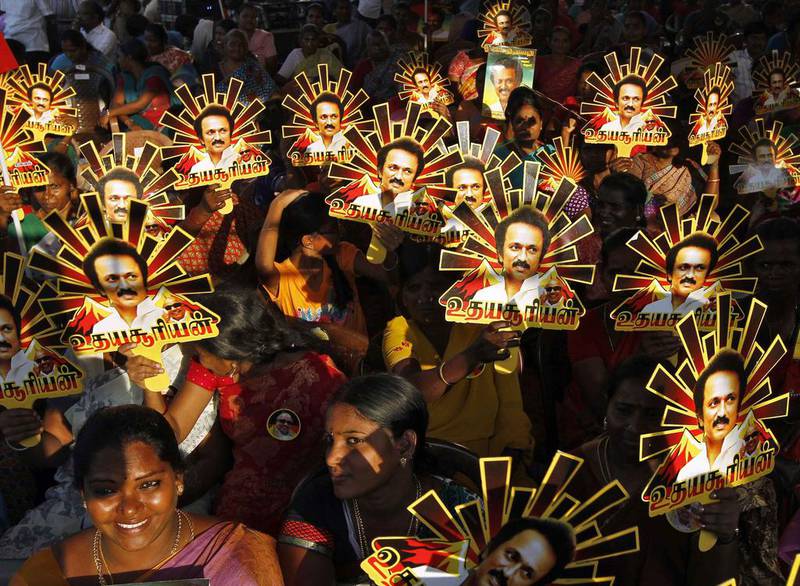 Supporters hold up cut-outs with images of Tamil Nadu Chief Minister MK Stalin in Chennai last April. Reuters
