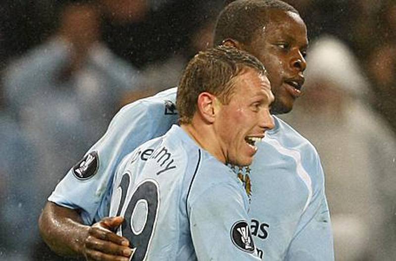 Manchester City's Craig Bellamy, left, with teammate Nedum Onuoha. Bellamy faces increased competition up front this season. Phil Noble / ReutersManchester City's Craig Bellamy, left, with teammate Nedum Onuoha. Bellamy faces increased competition up front this season.