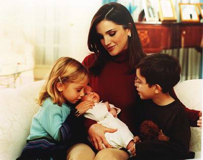 383601 02: Queen Rania of Jordan holds Princess Salma in her arms November 20, 2000 in Amman, Jordan as Princess Eman, left, and Prince Hussein, right, look on. (Photo by Salah Malkawi/Newsmakers)