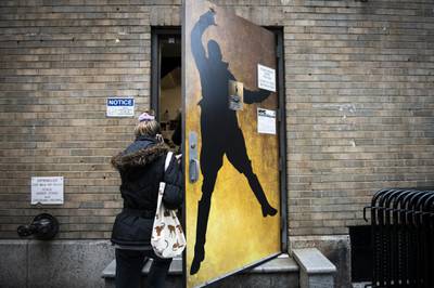 A person enters the staff and performers entrance of Richard Rodgers Theatre where the musical Hamilton is performed in Broadway. Bloomberg
