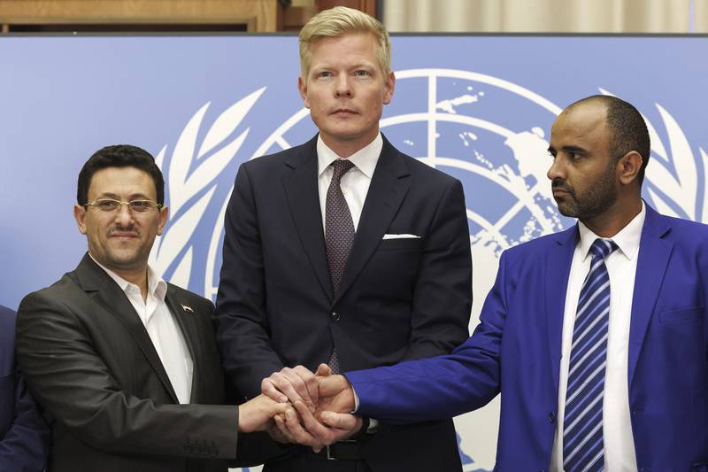 From left, Houthi representative Abdul Qader Al Murtaza, the UN's Hans Grundberg and Yemen's Yahya Mohammed Kazman after a prisoner-exchange meeting. AP