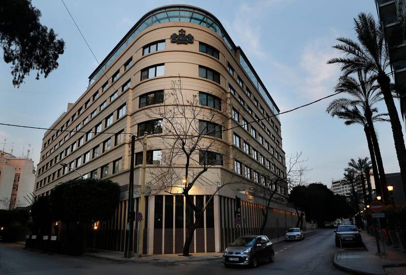 A car drives past Le Bristol hotel in Beirut, Lebanon. One of the country's landmark hotels that has survived the country's bloody 15-year civil war is closing its doors due to a combination of an economic crisis and the global health threat of coronavirus. AP Photo