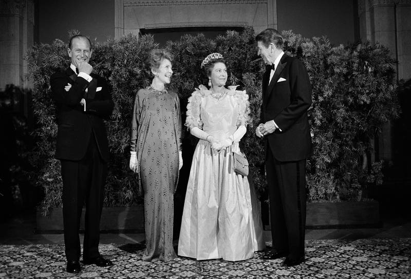 Ronald Reagan, the US president at the time, and first lady Nancy Reagan pose for photographers with Queen Elizabeth and Prince Philip at a state dinner on March 3, 1983, in San Francisco, California. AP