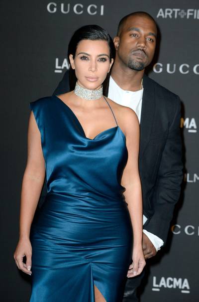 epa04472939 US singer Kanye West (R) and his wife US celebrity personality Kim Kardashian (L) arrive for the 2014 LACMA Art + Film Gala at the Los Angeles County Museum of Art (LACMA) in Los Angeles, California, USA, 01 November 2014. The event honored US artist Barbara Kruger and US director Quentin Tarantino.  EPA/MICHAEL NELSON