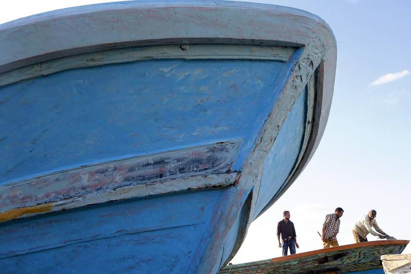 Fishermen repair their boats in the El Max area Alexandria. Amr Abdallah Dalsh / Reuters