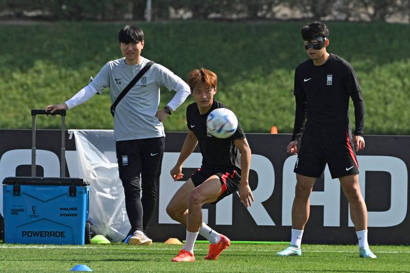 South Korea's defender Kim Jin-su and Son Heung-min take part in a training session at Al Egla in Doha. AFP