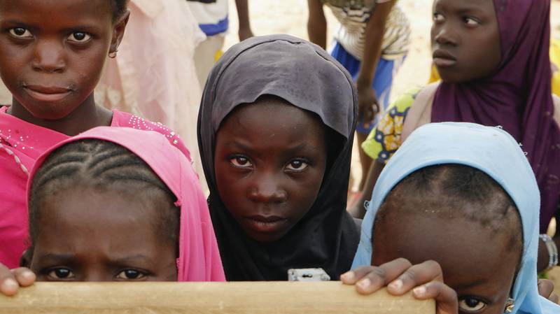Displaced children attend class in Dori town, Burkina Faso. Violent insurgencies in the central Sahel region of Africa continued to drive internal displacement, particularly in Burkina Faso. AP
